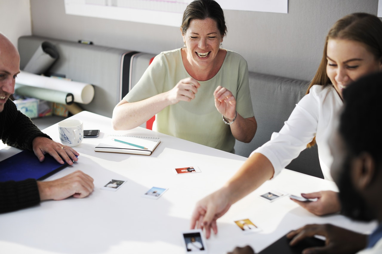 Collaborative leadership style: a team laughing around a table